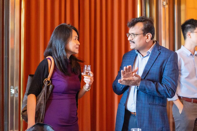 Delegates networking at a Singapore corporate event reception — RS Photography
