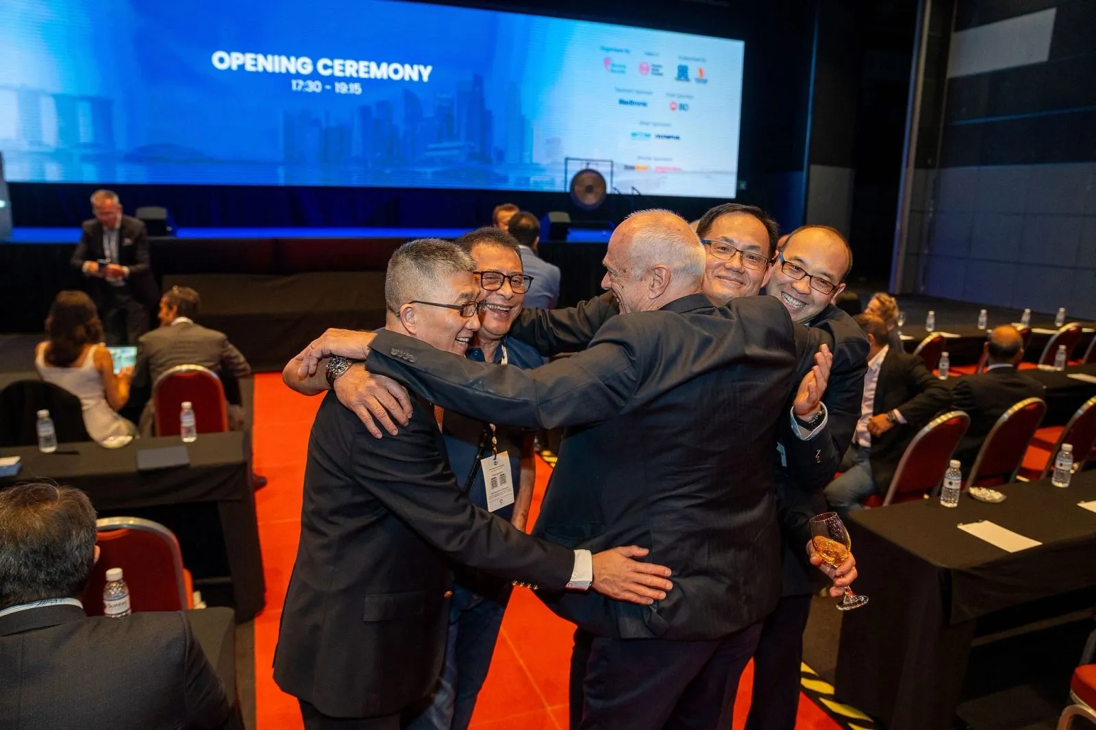 Delegates celebrating at the opening ceremony of an international congress in Singapore — RS Photography