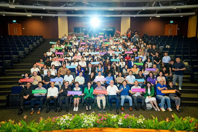 Auditorium group photo from a corporate event gallery